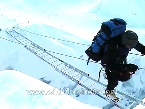 Crevasses crossing using three ladder bridge at Khumbu icefall