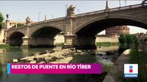 Ola de calor baja nivel del agua en río Tíber y revela puente