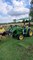 Grandson Lifts Grandpa Up in Tractor Bucket