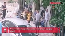 Amasya'da bir bebek balkondan apartman görevlisinin üzerine düştü