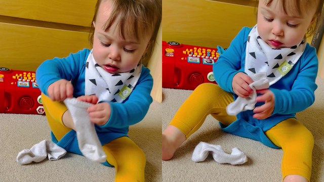 'Adorable baby girl struggles BIG TIME with putting a sock on '