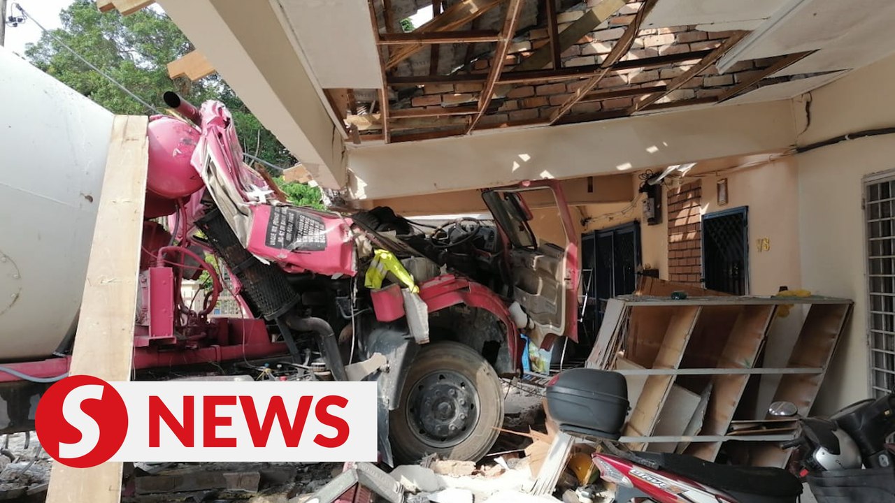 Faulty brakes cause cement mixer lorry to crash into two houses