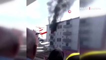 Yangında balkondan atlayan kadını havada tuttu