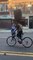 NYC Cyclist Balances Suitcase on Head While Biking