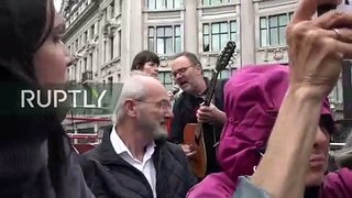 Pro-Assange activists tour London on open top bus