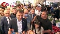 İmamoğlu'nun yanına gelen yaşlı yurttaş cebindeki bozuk paraları gösterdi