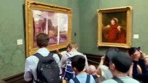Just Oil protesters glue themselves to painting at National Gallery. Credit: Just Oil