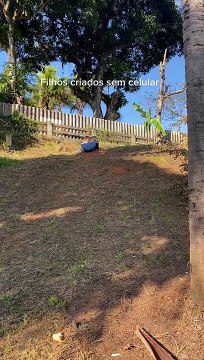 Little girl Slides Down Dirt Hill in Makeshift Sled