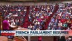 Divided French parliament gives new PM tough time during first address