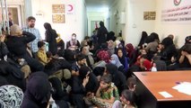 Türk Kızılaydan Irak'ta ihtiyaç sahibi ailelere kıyafet ve kurban eti yardımı