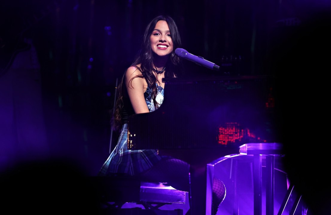 Olivia Rodrigo performs at a show in London wit...