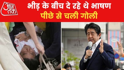 Shinzo Abe being given CPR after he falls on ground