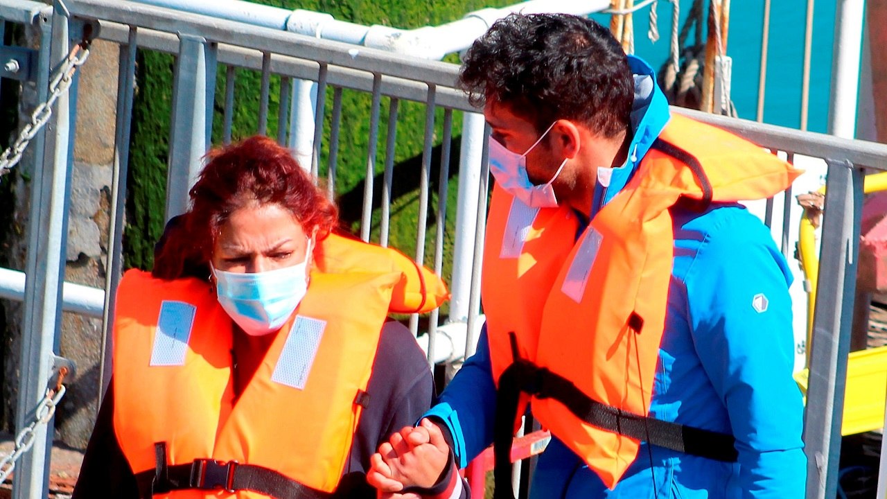 Migrants made up of men, women and children arrive in Dover after being picked up in the English Channel