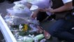 People lay flowers, pay respects at Abe murder scene