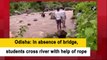 Odisha: In absence of bridge, students cross river with help of rope