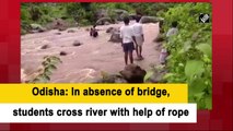 Odisha: In absence of bridge, students cross river with help of rope