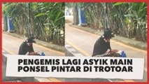 Video Viral Pengemis Lagi Asyik Main Ponsel Pintar di Trotoar, Warganet: Dia Lagi Ngemis Online