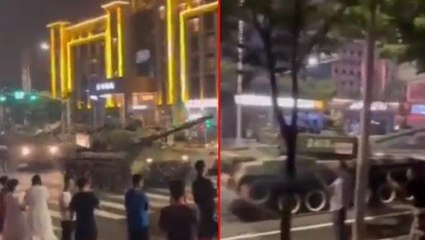 Banka krizi Çin'i felakete sürüklüyor! Güvenlik güçleriyle çıkan arbede sonrası şube önüne tanklar konuşlandırıldı