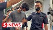 Johor man charged with murdering wife, baby son