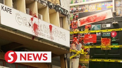 Crackhouse Comedy Club splashed with red and black paint