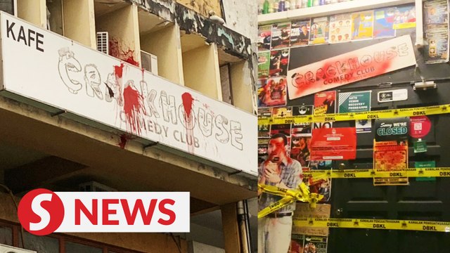 Crackhouse Comedy Club splashed with red and black paint