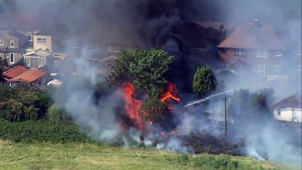 Heatwave: Fires burn down buildings in East London