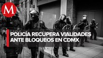 Elementos de la Policía retiran a manifestantes que piden la liberación de presunto agresor