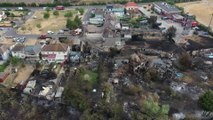 A woman fled her burning home in scorched Wennington with just her photo album, a cat and her dead father's ashes, it emerged today