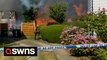 UK fires: Dramatic moment suspected barbecue or garden fire lit before engulfing nearby houses