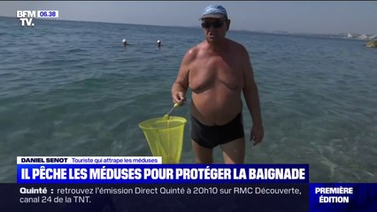 Download Video: Épuisette à la main, ce touriste lorrain traque les méduses sur la plage de Cagnes-sur-Mer