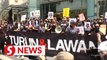 Protesters disperse after a one-hour rally over price hikes in KL
