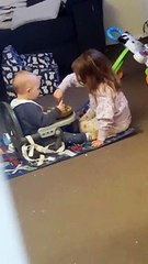 Big Sister Helping Her Little Brother Finish His Dinner