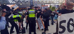 Flash mob in support of strikers are met by Police inside Central Station, Glasgow