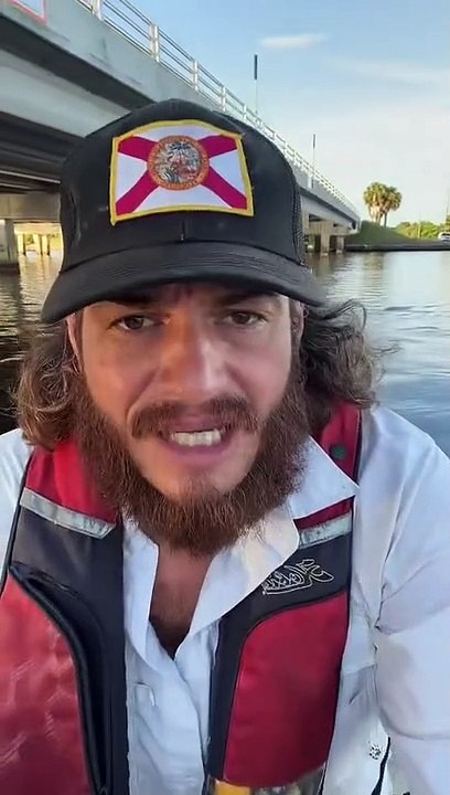 Kayaker Removes Potential Fishing Hook Trap at Water Level
