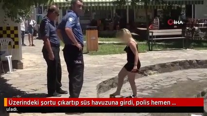 Üzerindeki şortu çıkartıp süs havuzuna girdi, polis hemen harekete geçti
