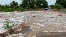 Watch as a wall of water surges across roads in Arizona