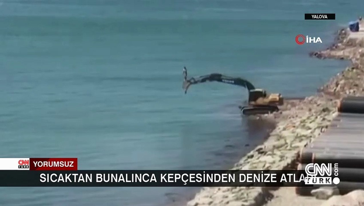 Sıcaktan bunalan kepçe operatöründen ilginç serinleme yöntemi