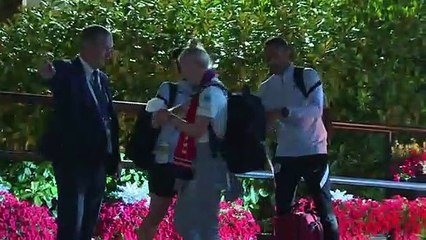 Champion Lionesses celebrate as they arrive back at hotel