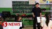 Retired violinist teaches children in north China mountains