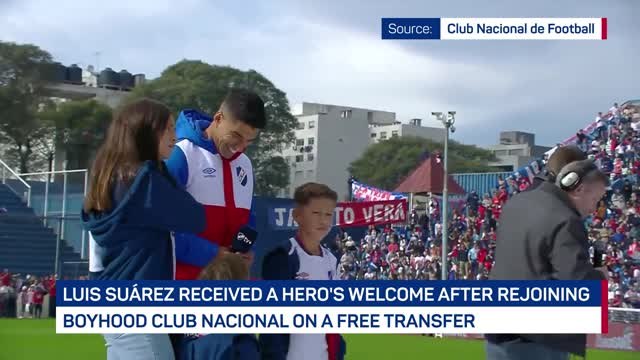 Suarez receives hero's welcome at Nacional presentation