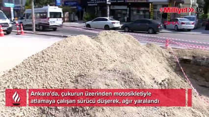 Motosiklet sürücüsünün çukurun üzerinden atladığı anlar kamerada