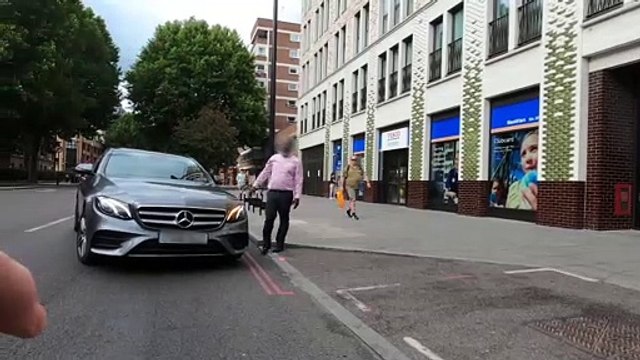 Foul-mouthed cyclist rages at driver after colliding in central London when vehicle suddenly pulls in