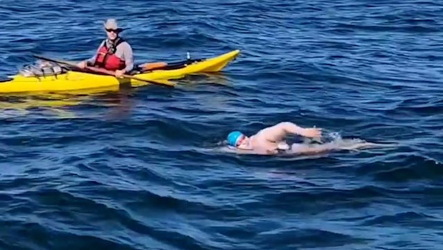 Taking on the daunting task of swimming across Lake Erie