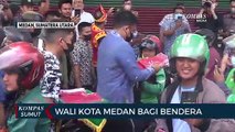 Menyambut HUT RI, Pengendara di Medan Mendapat Bendera Merah Putih