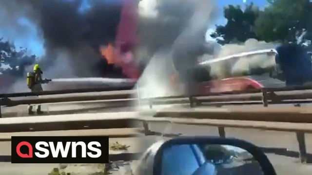 Dramatic footage captures bus billowing smoke and flames after catching fire while in service