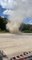Person Witness Huge Dust Devil Formation on Windy Day