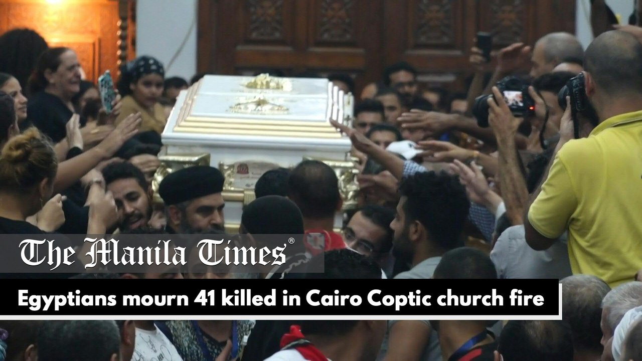 Egyptians mourn 41 killed in Cairo Coptic church fire