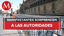 Manifestantes brincan vallas en Palacio Nacional en CdMx