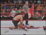Chris Jericho flattens John Cena with a chair