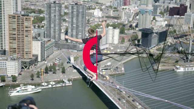 Slackliner Jaan Roose completes 625 m river crossing between highest buildings in Rotterdam